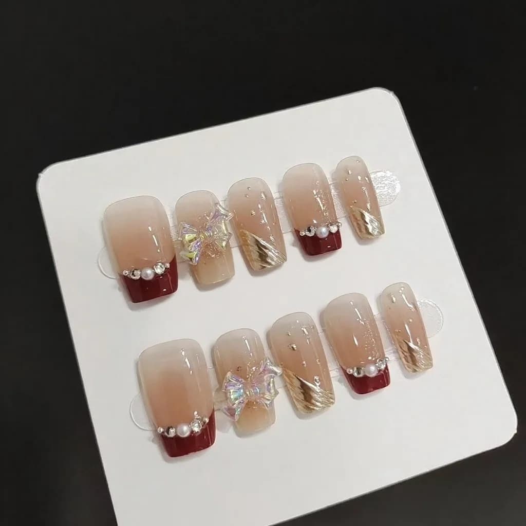 Unhas Postiças com Ponta Francesa Curta, Glitter Dourado e Design de Laço
